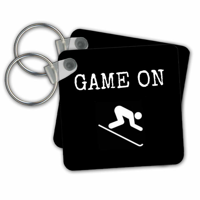 Key Chain - game on, white lettering on black background with picture of skier Xander sports sayings