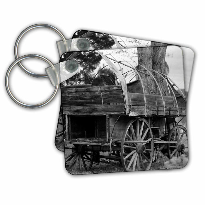 Key Chain - An old Pioneer wagon on a setting by a tree Black and White