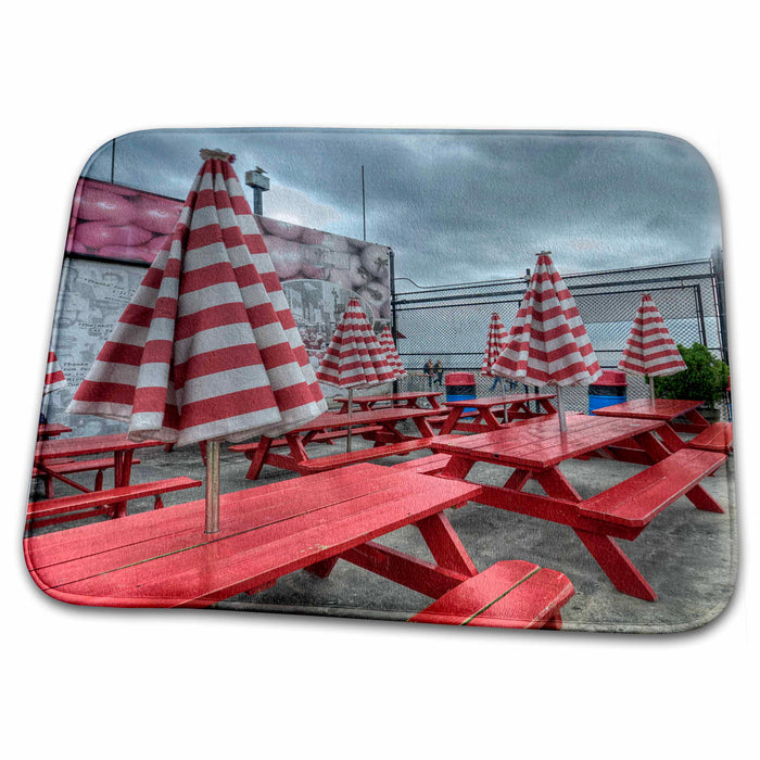 Dish Drying Mat - red stripe umbrellas on red wooden tables at amusement park Photography